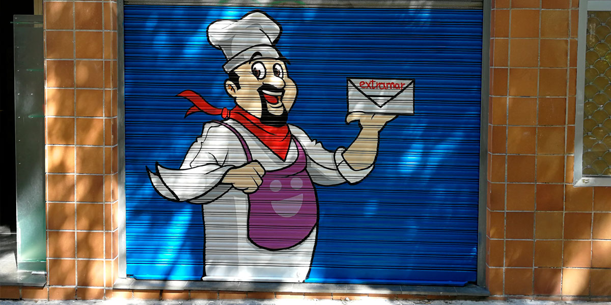 Graffiti de dibujo de cocinero en cierre metálico.