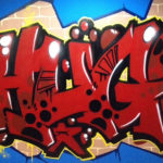 Graffiti de Hugo con mando de la PlayStation en Madrid