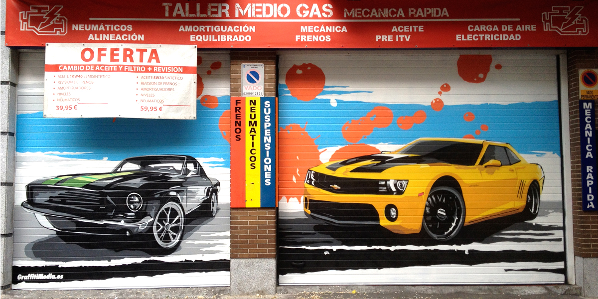 Graffiti de coches en taller mecánico de Madrid